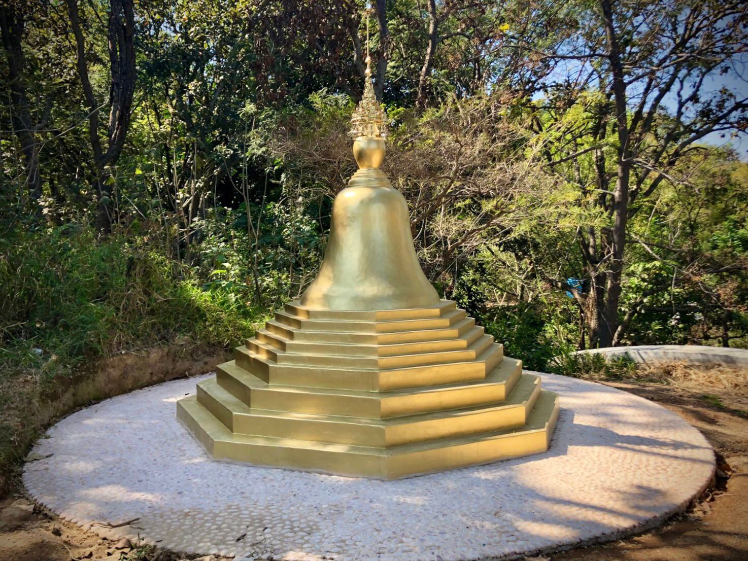 Golden Buddhist stupa with relics at Theravada monastery Mexico